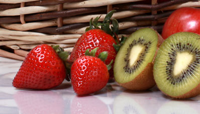 closeup image of strawberrries and kiwis